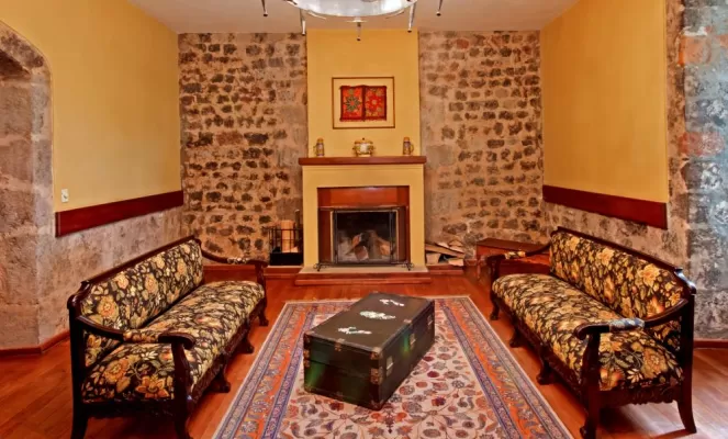 Relax by the fire in the La Cienega sitting room