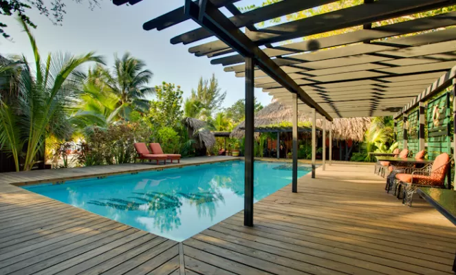 Enjoy the pool at Singing Sands Resort after a day of exploring Belize