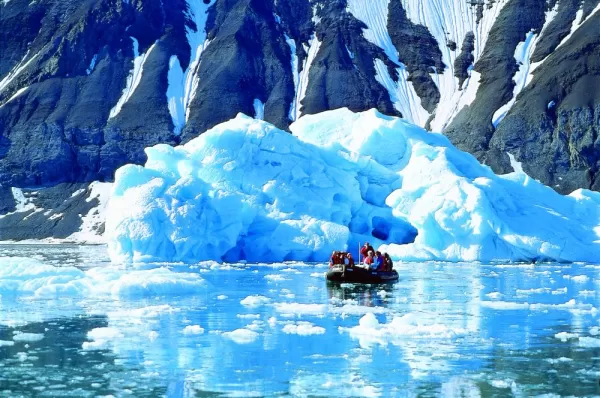 Taking a zodiac tour to see icebergs in the arctic.