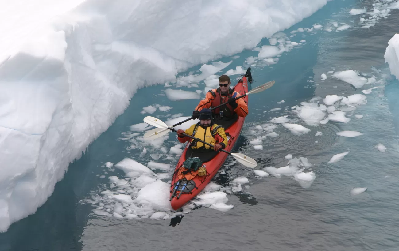 Kayaking through arctic waters.