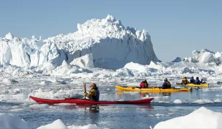 Kayaking through the icy waters.