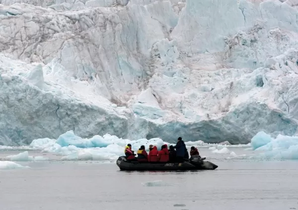 Take to a zodiac to explore massive ice formations up close