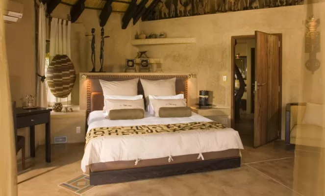 Relax in the spacious and comfortable rooms at Okonjima Bush Camp