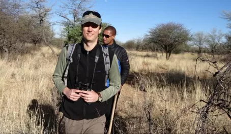 Travelers taking a hike through the African landscape