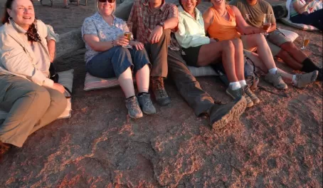 A group of travelers watching the sunset