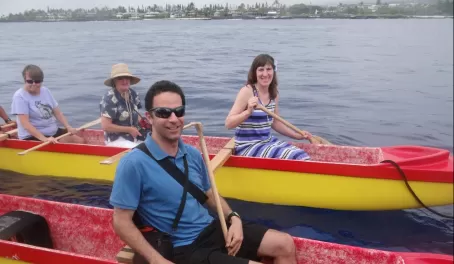 Paddling on an outrigger canoe tour