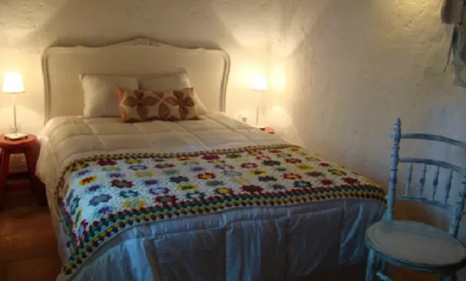 Traditional guestroom with crocheted blankets