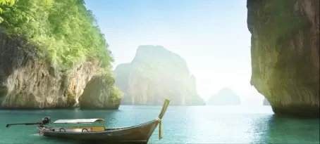 Long-tailed boat on beach of island in Krabi Province